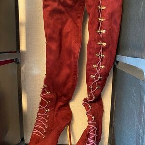Thigh high red heel lace up boots